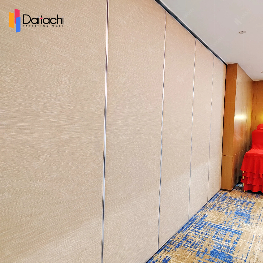 Light wood manual movable partition wall with blue carpet