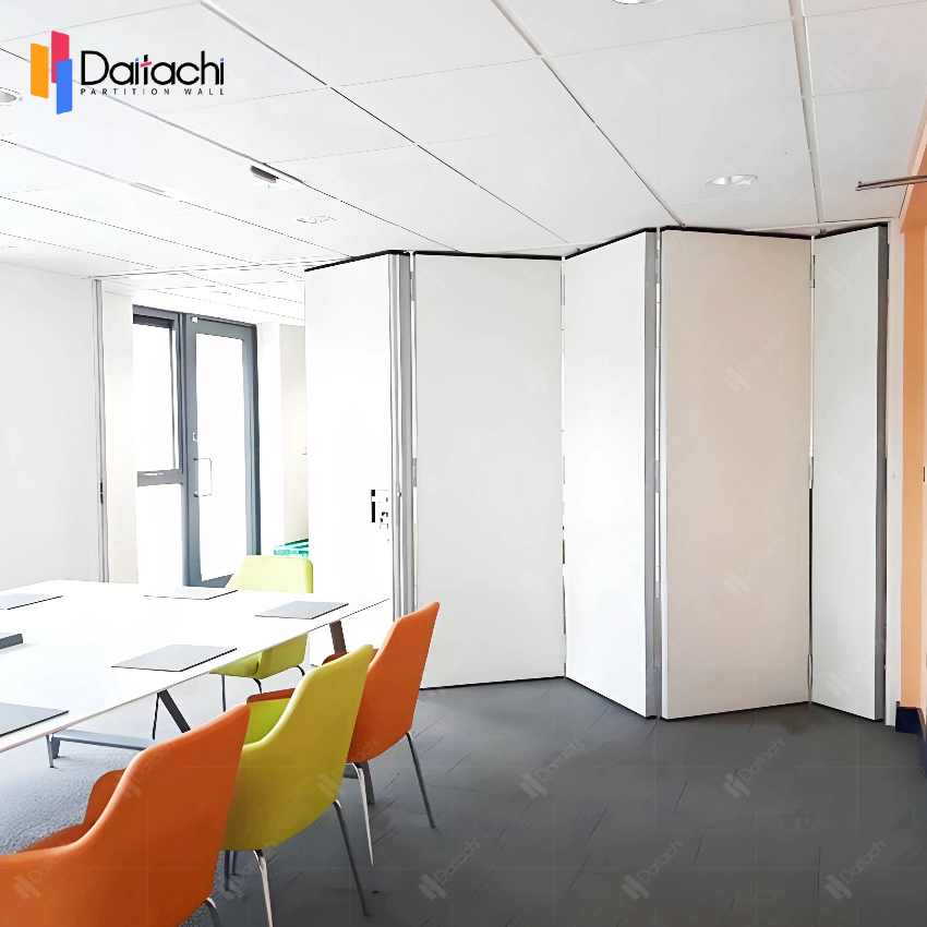 Orange and yellow tables and chairs are paired with simple white manual movable partition walls.